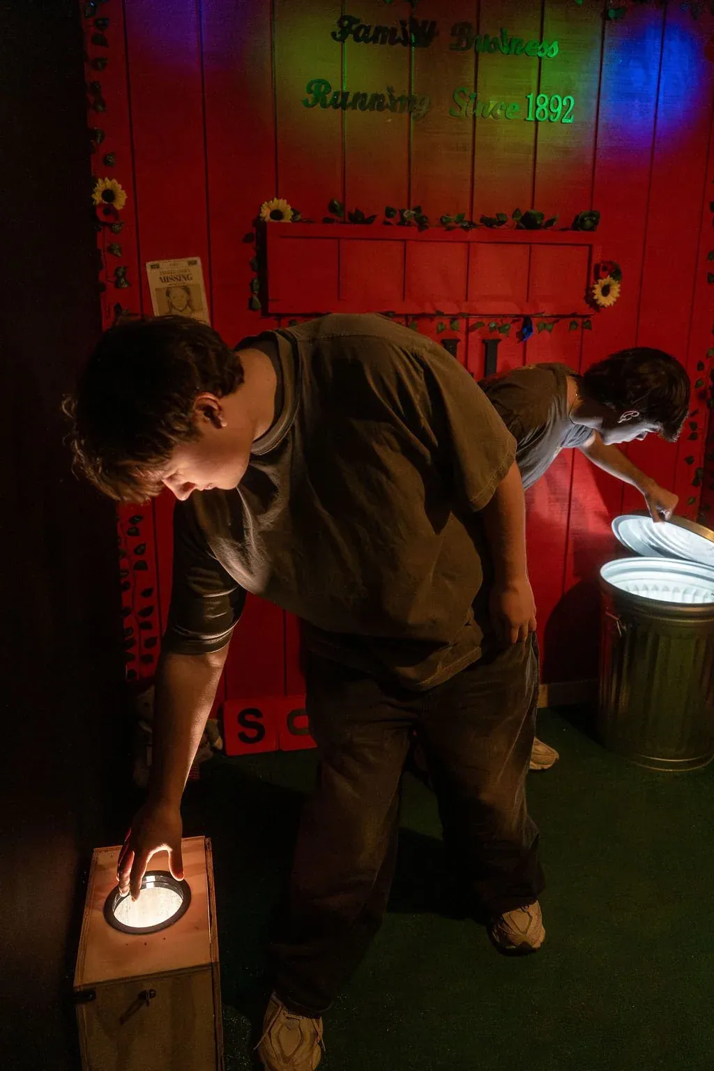 Player solving a lit puzzle box in the Haunted Doll Shop escape room